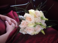 Hand tied brides maid flower bouquet, roses and lisianthus